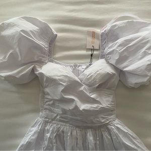 White rounded bottom dress